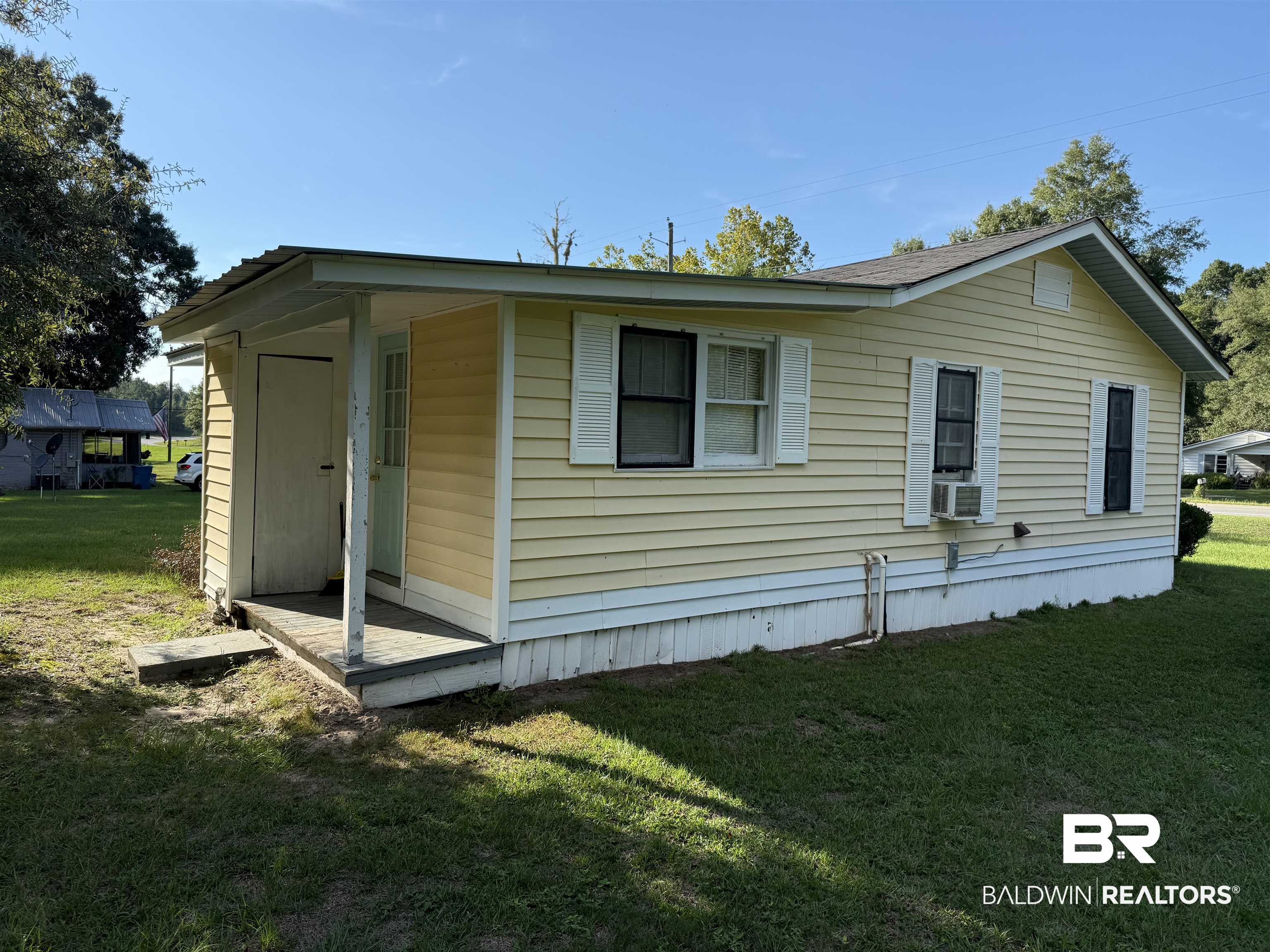 3630 Highway 29 Brewton, AL 36426 - Photo 4 of 13 View of front of house featuring cooling unit and a front lawn