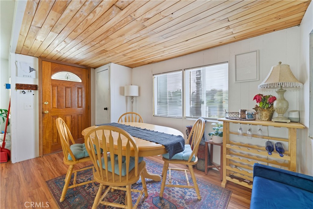 36200 Paradise Ranch Road Castaic, CA 91384 - Photo 11 of 31 a view of a dining room with furniture window and wooden floor