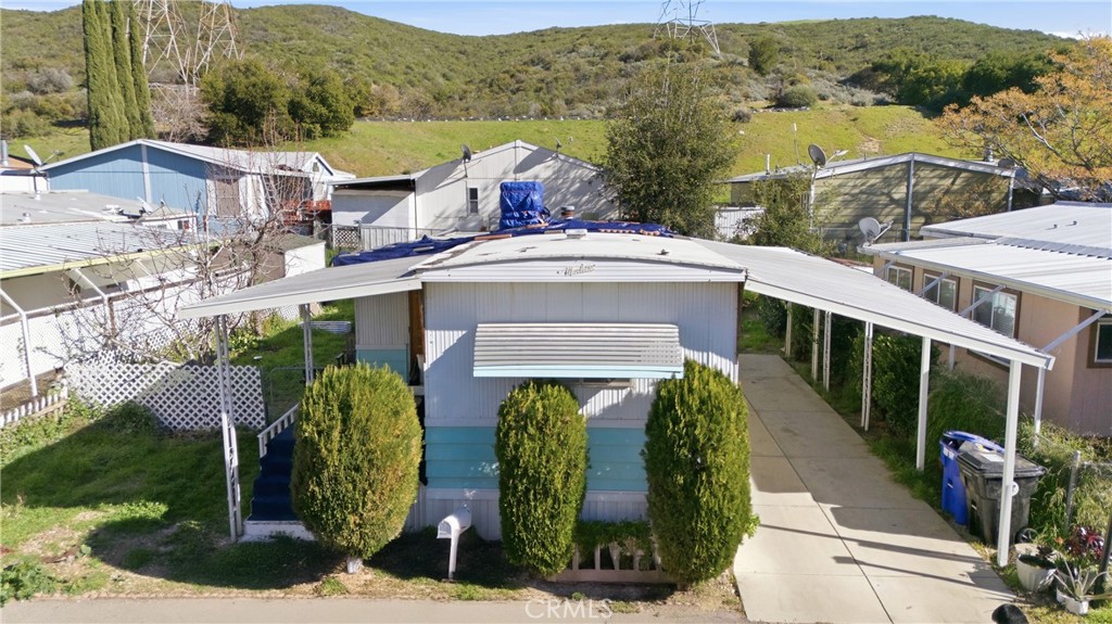 36200 Paradise Ranch Road Castaic, CA 91384 - Photo 2 of 31 a view of a house with roof and plants