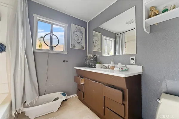 a room that has a sink and a mirror