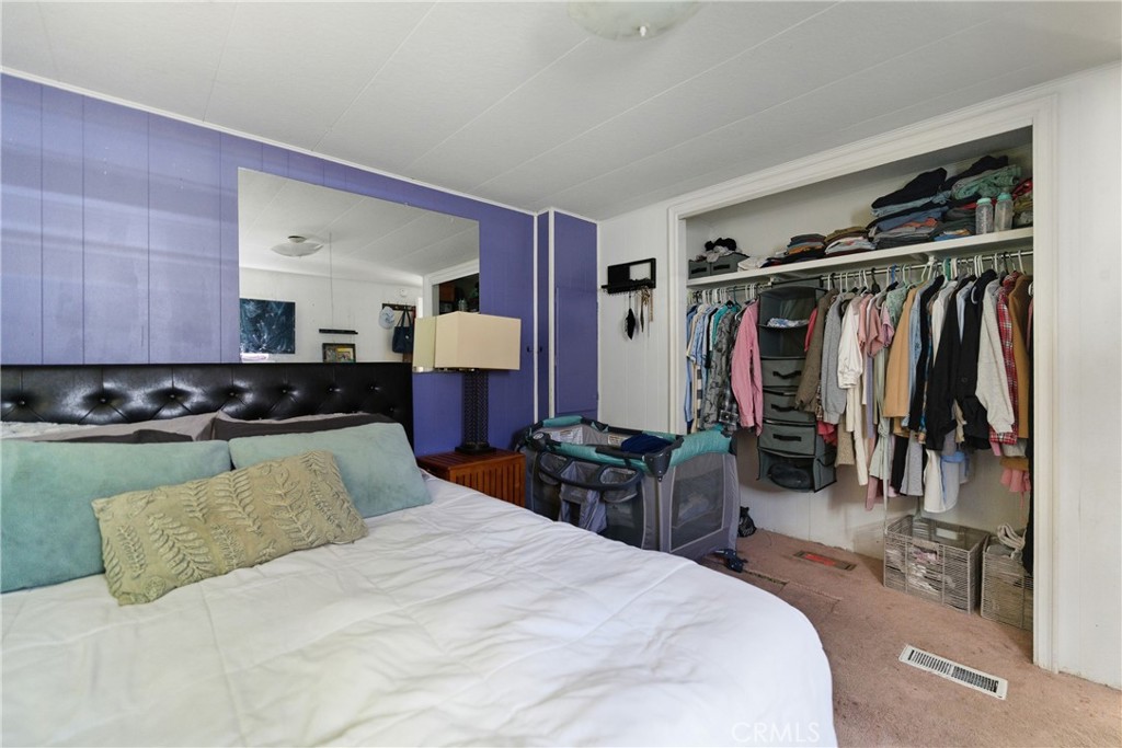 36200 Paradise Ranch Road Castaic, CA 91384 - Photo 27 of 31 a bedroom with a bed and walk in closet