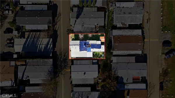 an aerial view of houses with outdoor space