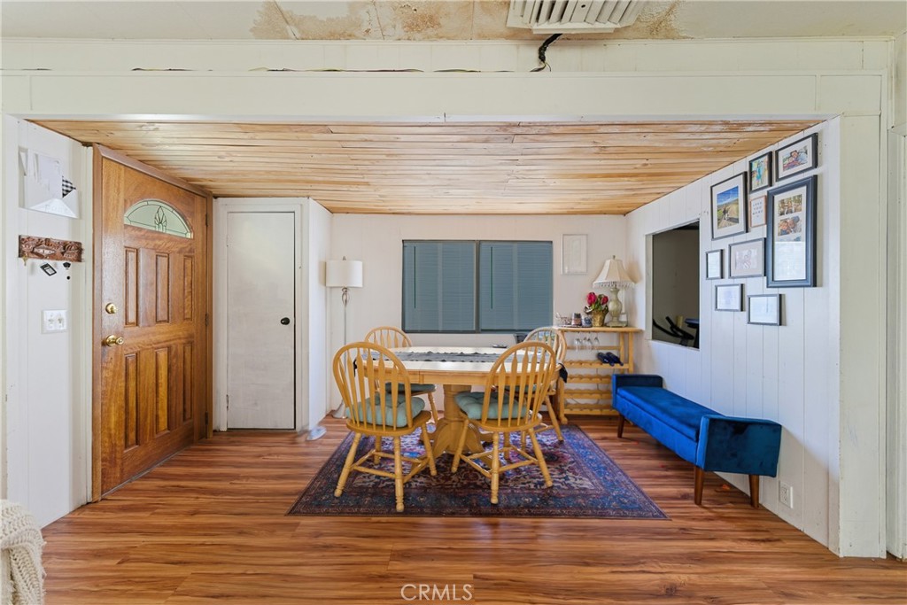 36200 Paradise Ranch Road Castaic, CA 91384 - Photo 9 of 31 a view of a dining room with furniture wooden floor and front door