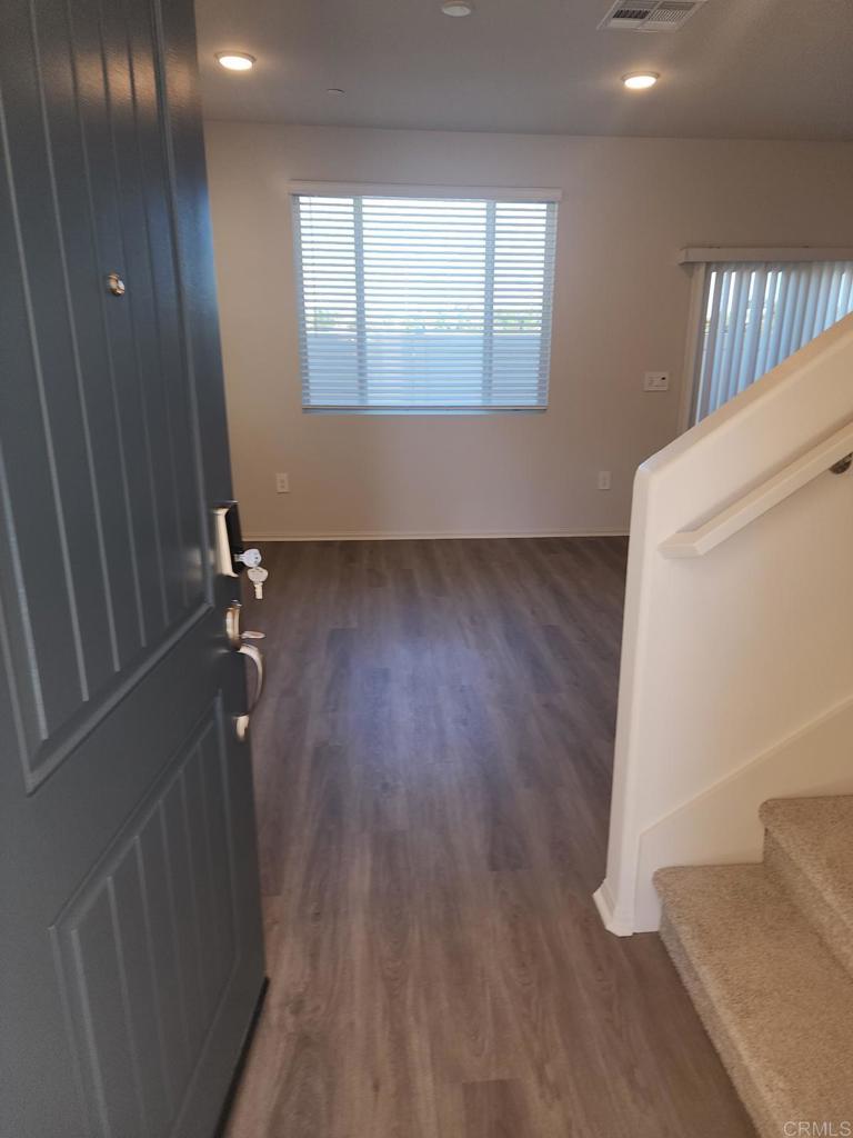 28386 Via Solero Temecula, CA 92591 - Photo 2 of 17 wooden floor in an empty room with a window