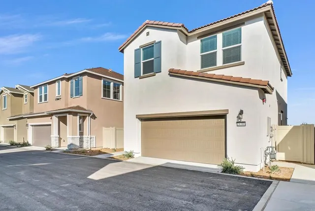 a front view of a house with a garage