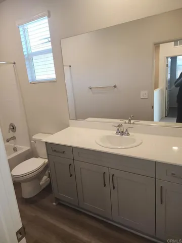 a bathroom with a sink toilet and vanity