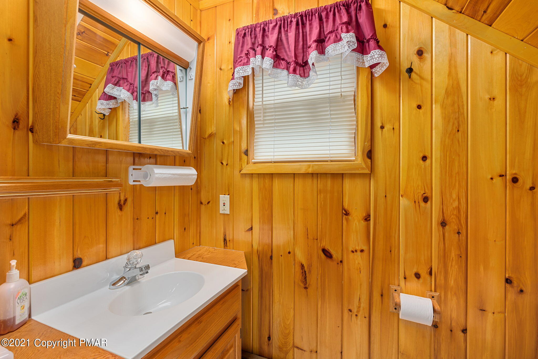 45 Long River Road Newfoundland, PA 18445 - Photo 34 of 46 a bathroom with a sink vanity and a mirror