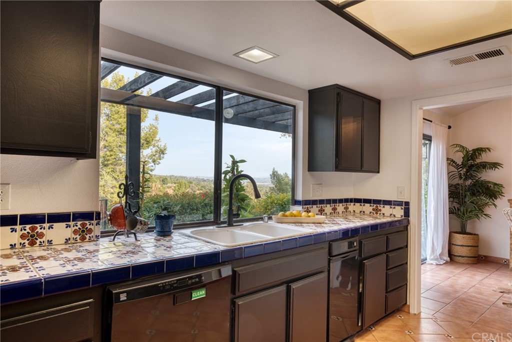 314 Shadow Lane Monrovia, CA 91016 - Photo 11 of 43 a kitchen with a sink and a large window