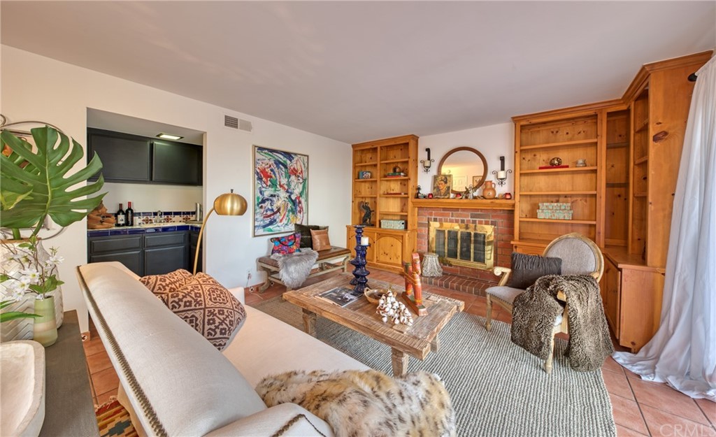 314 Shadow Lane Monrovia, CA 91016 - Photo 14 of 43 a living room with furniture a flat screen tv and a fireplace