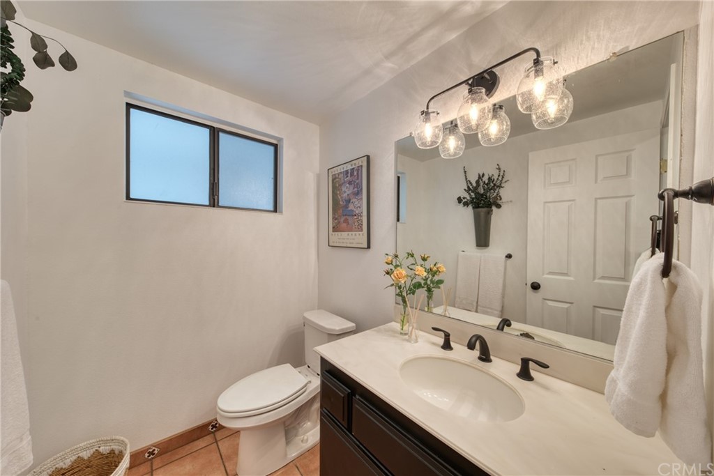 314 Shadow Lane Monrovia, CA 91016 - Photo 18 of 43 a bathroom with a sink a toilet and a mirror