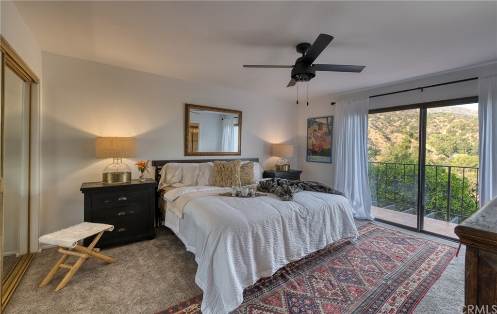 314 Shadow Lane Monrovia, CA 91016 - Photo 20 of 43 a bedroom with a bed and wooden floor