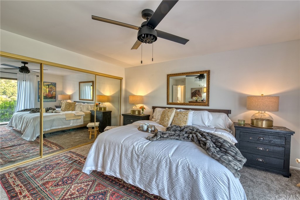 314 Shadow Lane Monrovia, CA 91016 - Photo 21 of 43 a spacious bedroom with a bed a couch and a chandelier