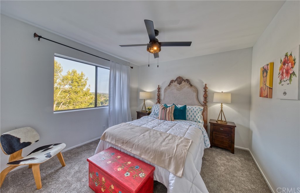 314 Shadow Lane Monrovia, CA 91016 - Photo 25 of 43 a bedroom with a bed a dresser next to a window