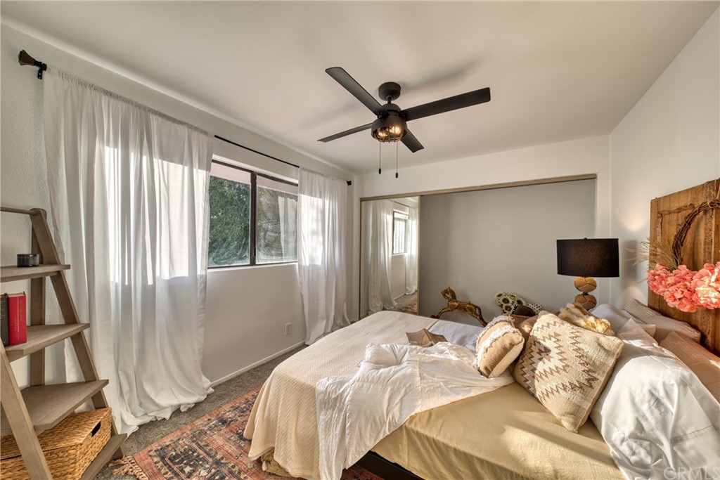 314 Shadow Lane Monrovia, CA 91016 - Photo 26 of 43 a bedroom with a bed a large window and a flat screen tv