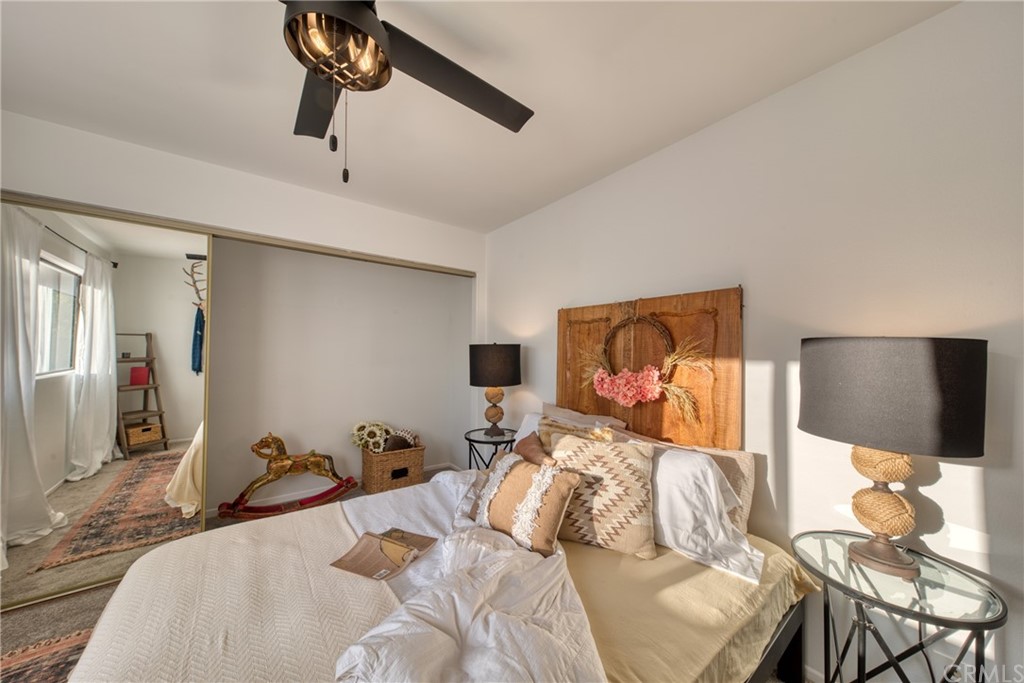 314 Shadow Lane Monrovia, CA 91016 - Photo 27 of 43 a bedroom with a bed and dresser with mirror