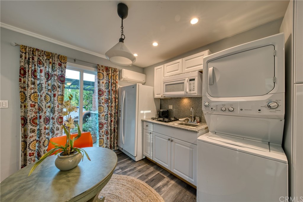 314 Shadow Lane Monrovia, CA 91016 - Photo 33 of 43 a kitchen that has a sink a stove and a refrigerator