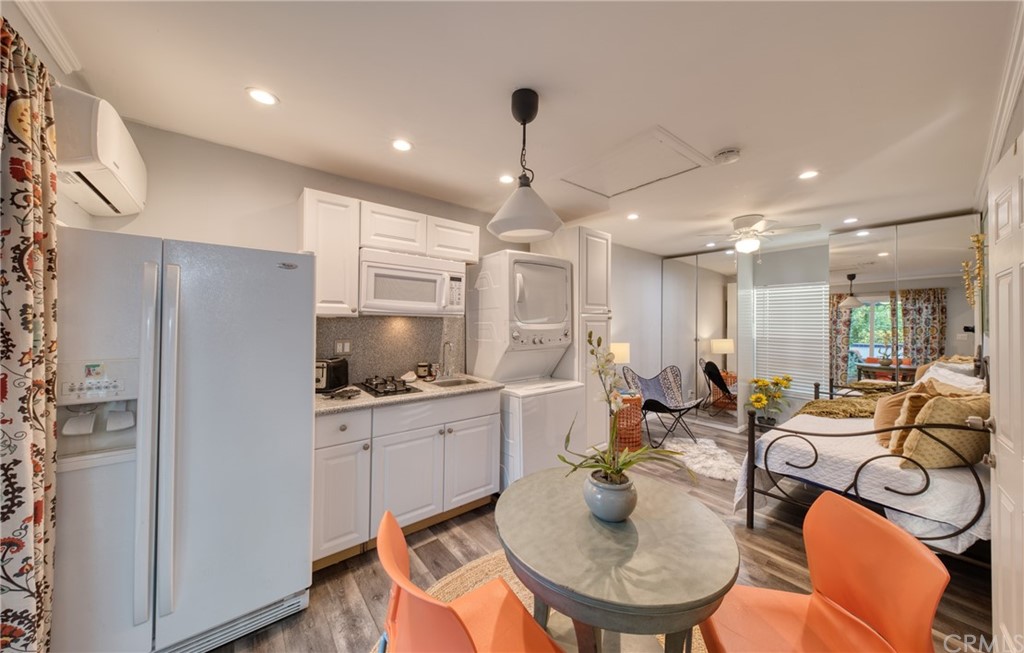 314 Shadow Lane Monrovia, CA 91016 - Photo 35 of 43 a kitchen with stainless steel appliances kitchen island granite countertop a sink refrigerator and cabinets