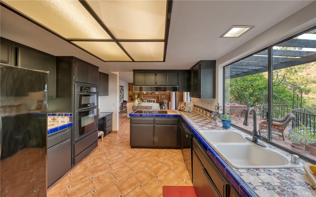 314 Shadow Lane Monrovia, CA 91016 - Photo 9 of 43 a kitchen with stainless steel appliances granite countertop a sink stove and cabinets