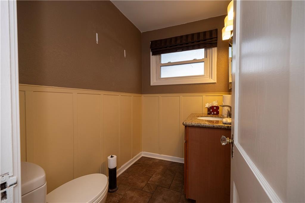 979 Seventh Street Beaver, PA 15009 - Photo 19 of 44 a bathroom with a granite countertop toilet and sink
