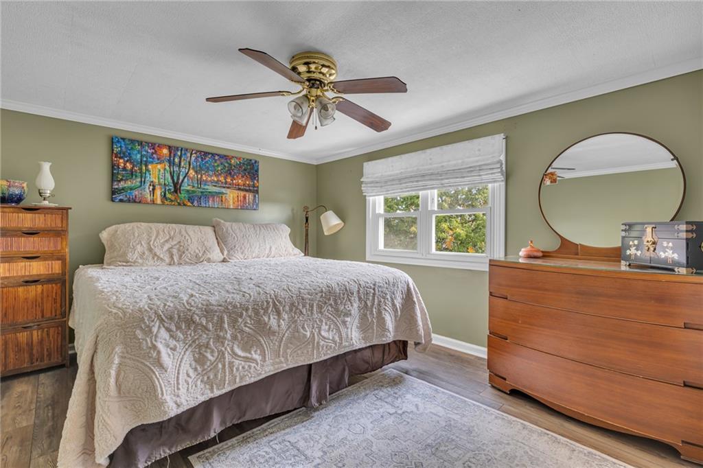 979 Seventh Street Beaver, PA 15009 - Photo 24 of 44 a bedroom with a bed and a chandelier