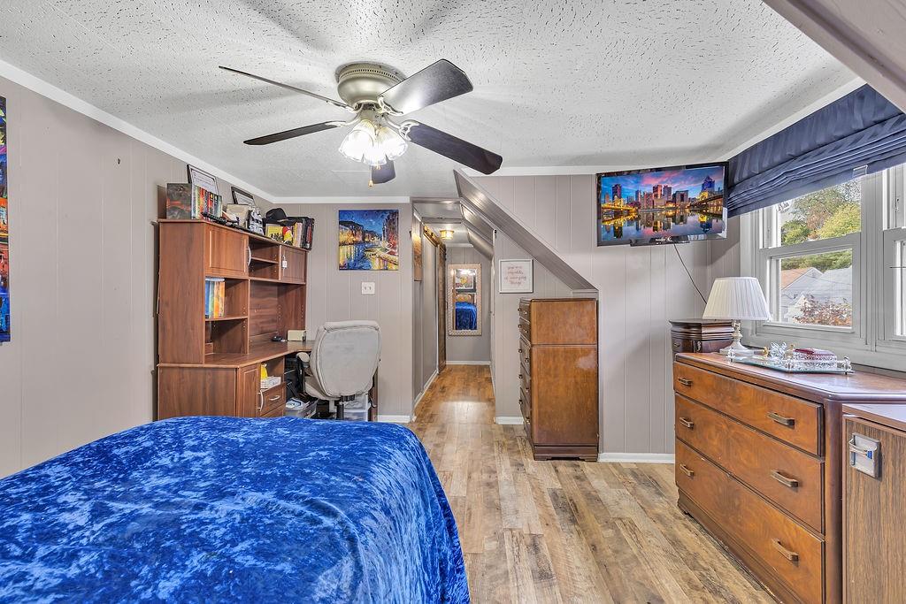 979 Seventh Street Beaver, PA 15009 - Photo 28 of 44 a bedroom with a bed and a chandelier