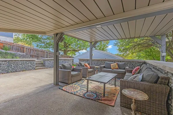 a outdoor living space with furniture and garden view