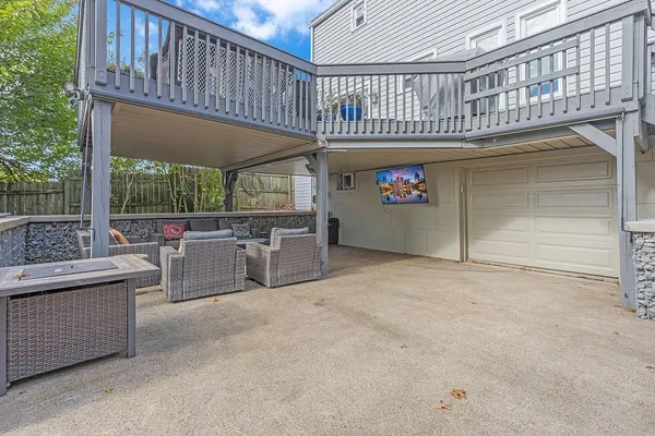 a balcony with furniture and a garden