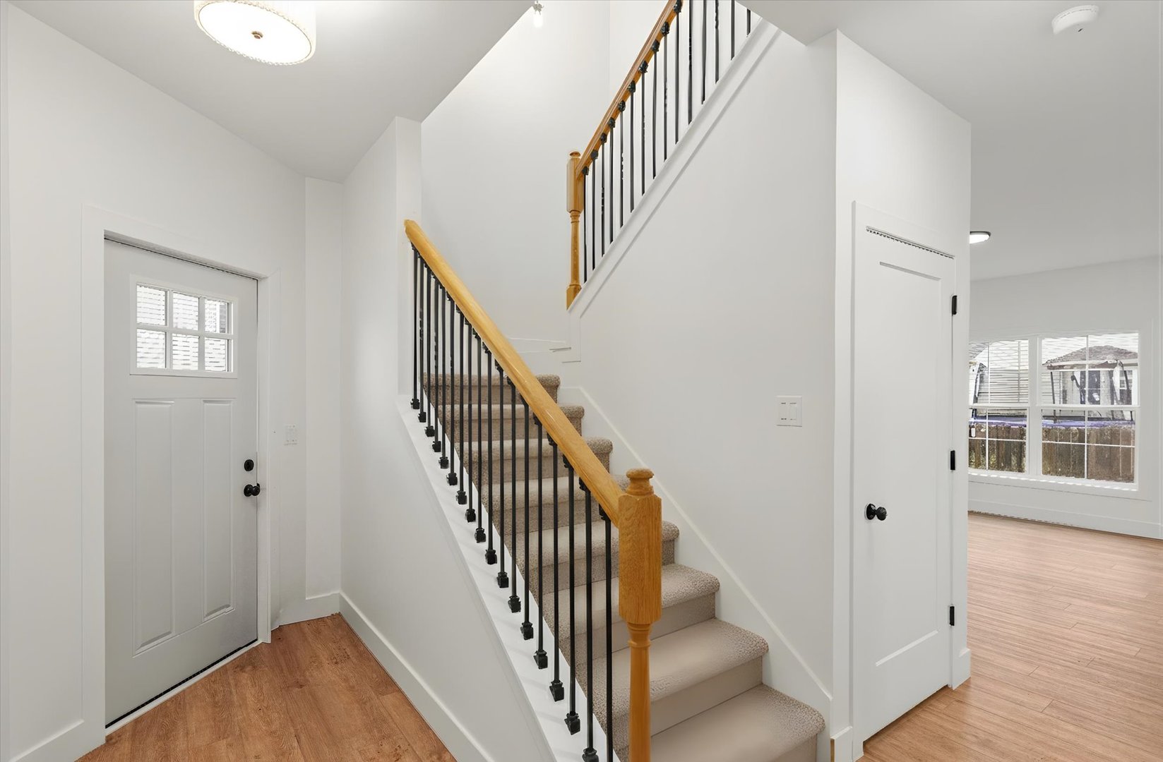 3708 Lighthouse Pointe Champaign, IL 61822 - Photo 2 of 35 a view of entryway with wooden floor and stairs