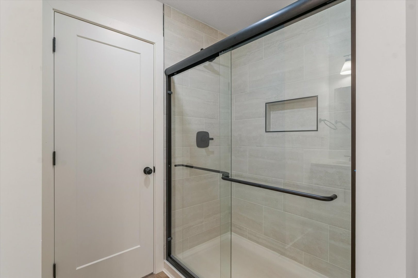 3708 Lighthouse Pointe Champaign, IL 61822 - Photo 34 of 35 a bathroom with a glass shower door