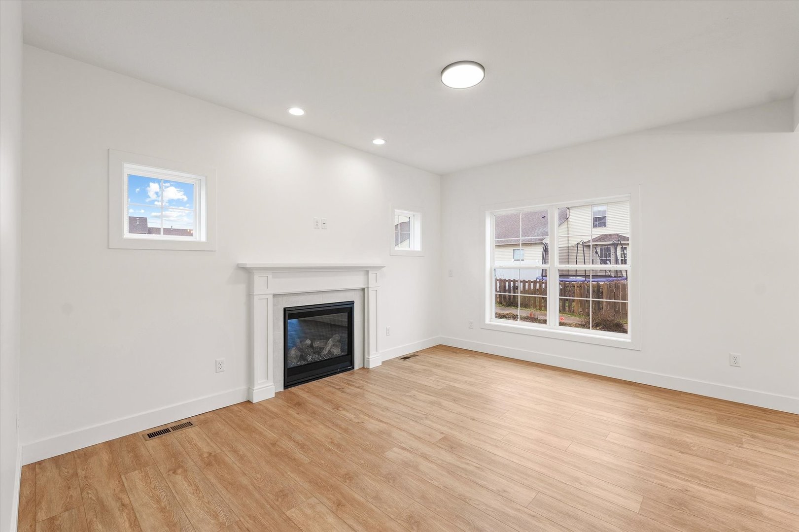 3708 Lighthouse Pointe Champaign, IL 61822 - Photo 8 of 35 a view of an empty room with a window and fireplace