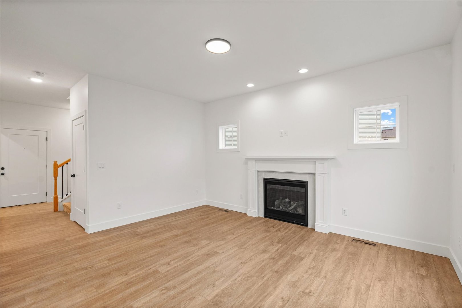 3708 Lighthouse Pointe Champaign, IL 61822 - Photo 9 of 35 a view of empty room with wooden floor and fireplace