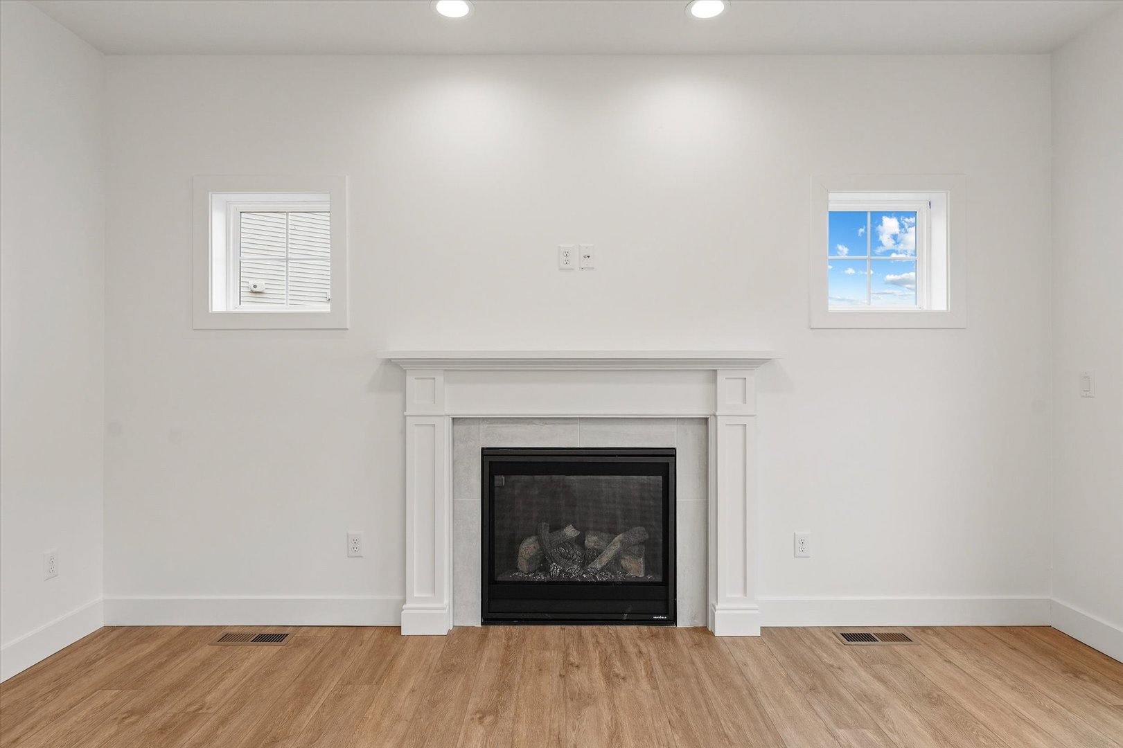 3708 Lighthouse Pointe Champaign, IL 61822 - Photo 10 of 35 a view of an empty room with wooden floor and a fireplace