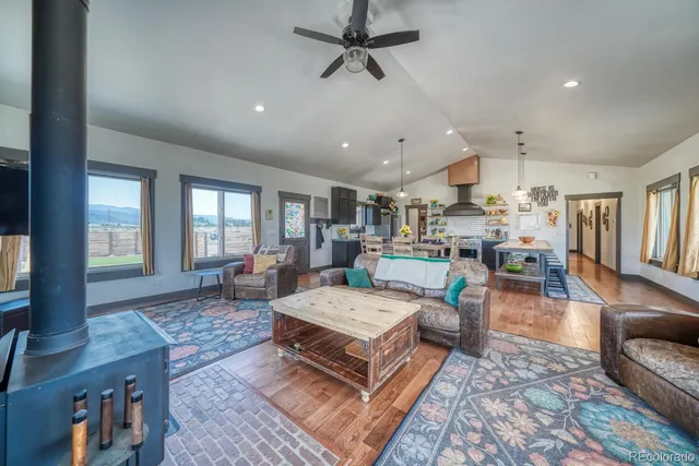 a living room with lots of furniture and a table