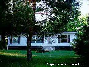 196 Off Route Lake Ariel, PA 18436 - Photo 1 of 1 a view of house with yard and outdoor seating