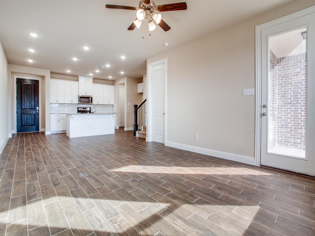 a view of a kitchen with a sink and cabinets