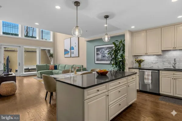 a kitchen with sink stove and cabinets