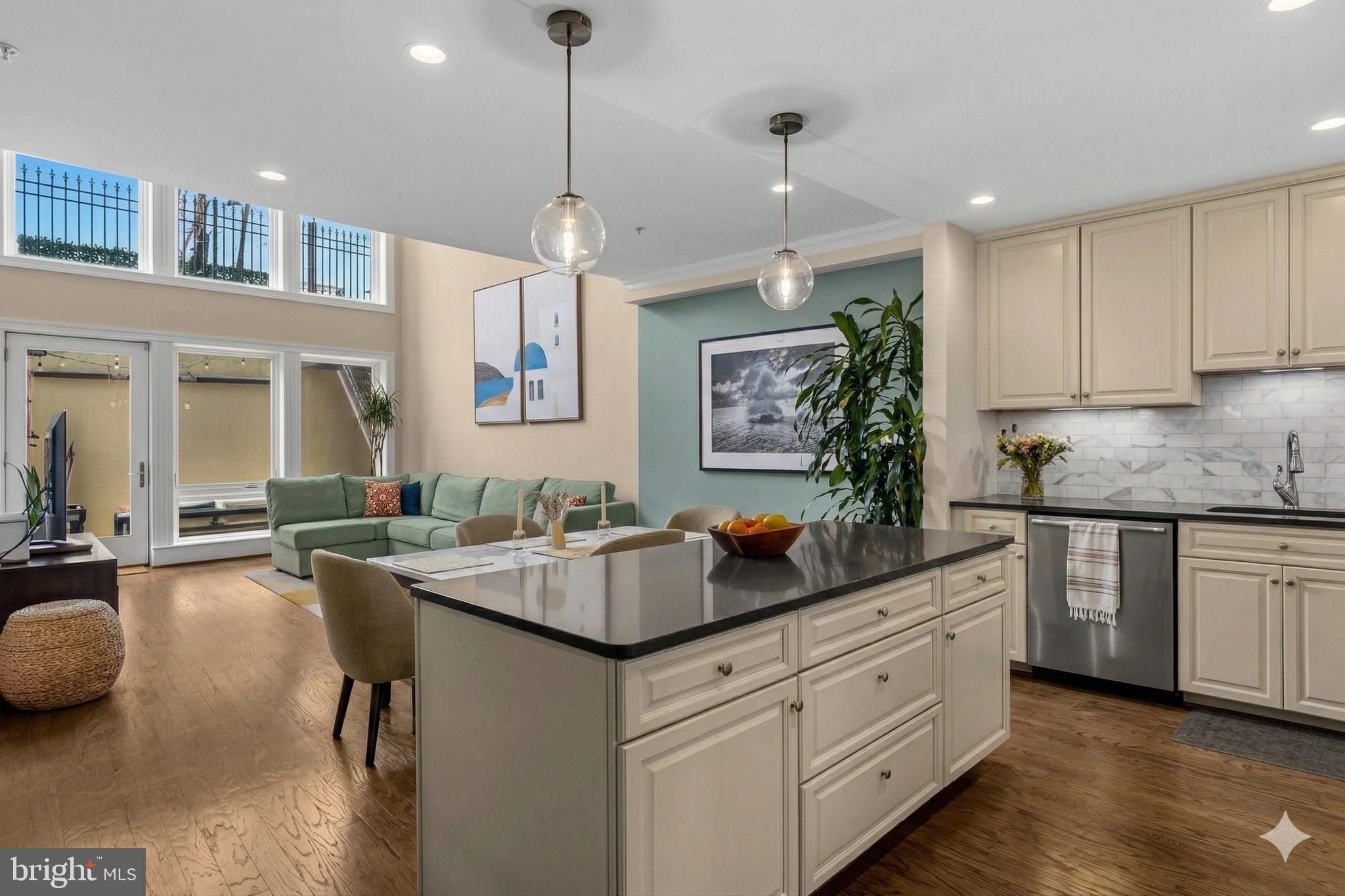 a kitchen with sink stove and cabinets