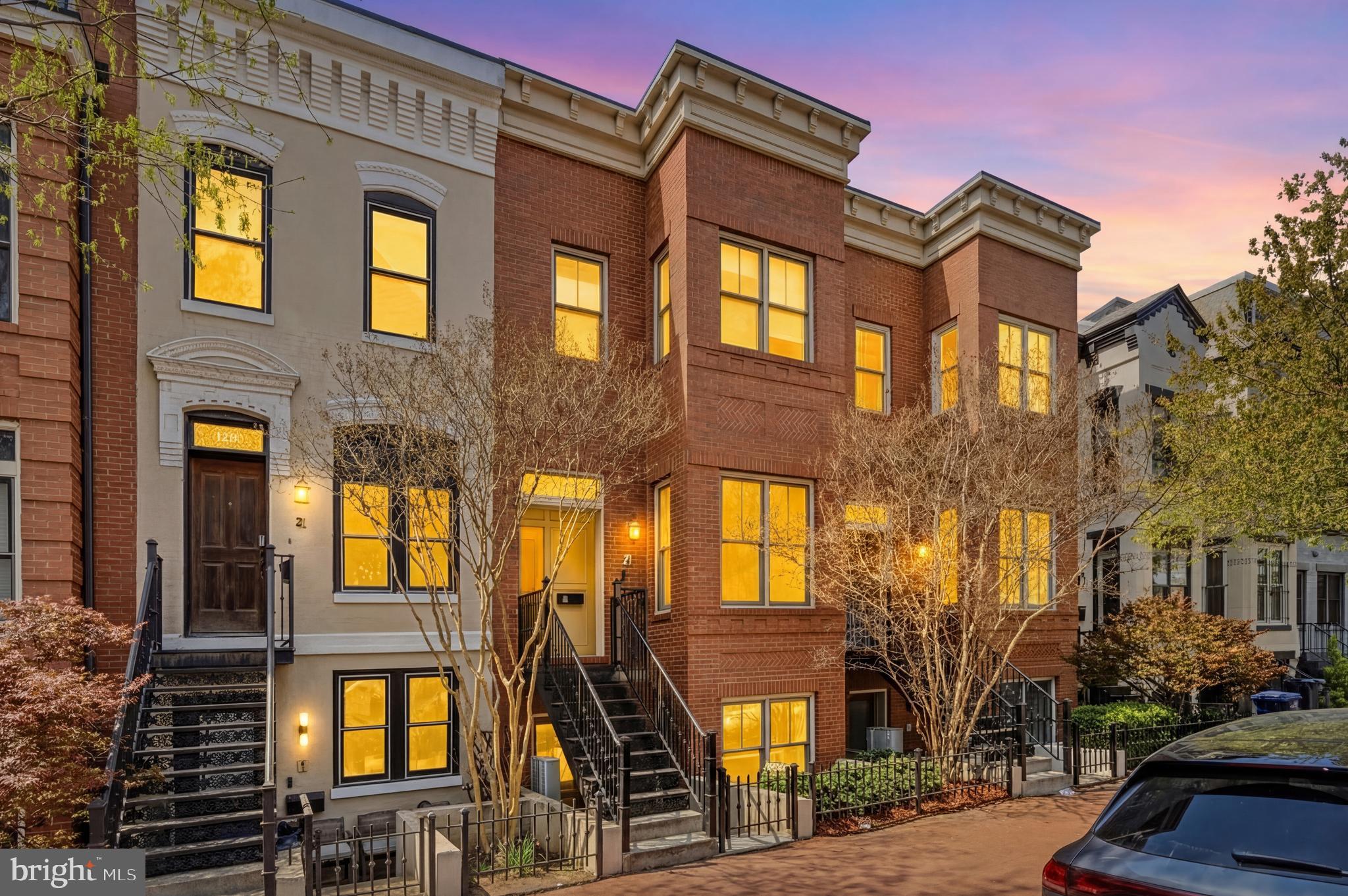 1232 4th Street Northwest, Unit 1 Washington, DC 20001 - Photo 2 of 28 a front view of a brick building with many windows