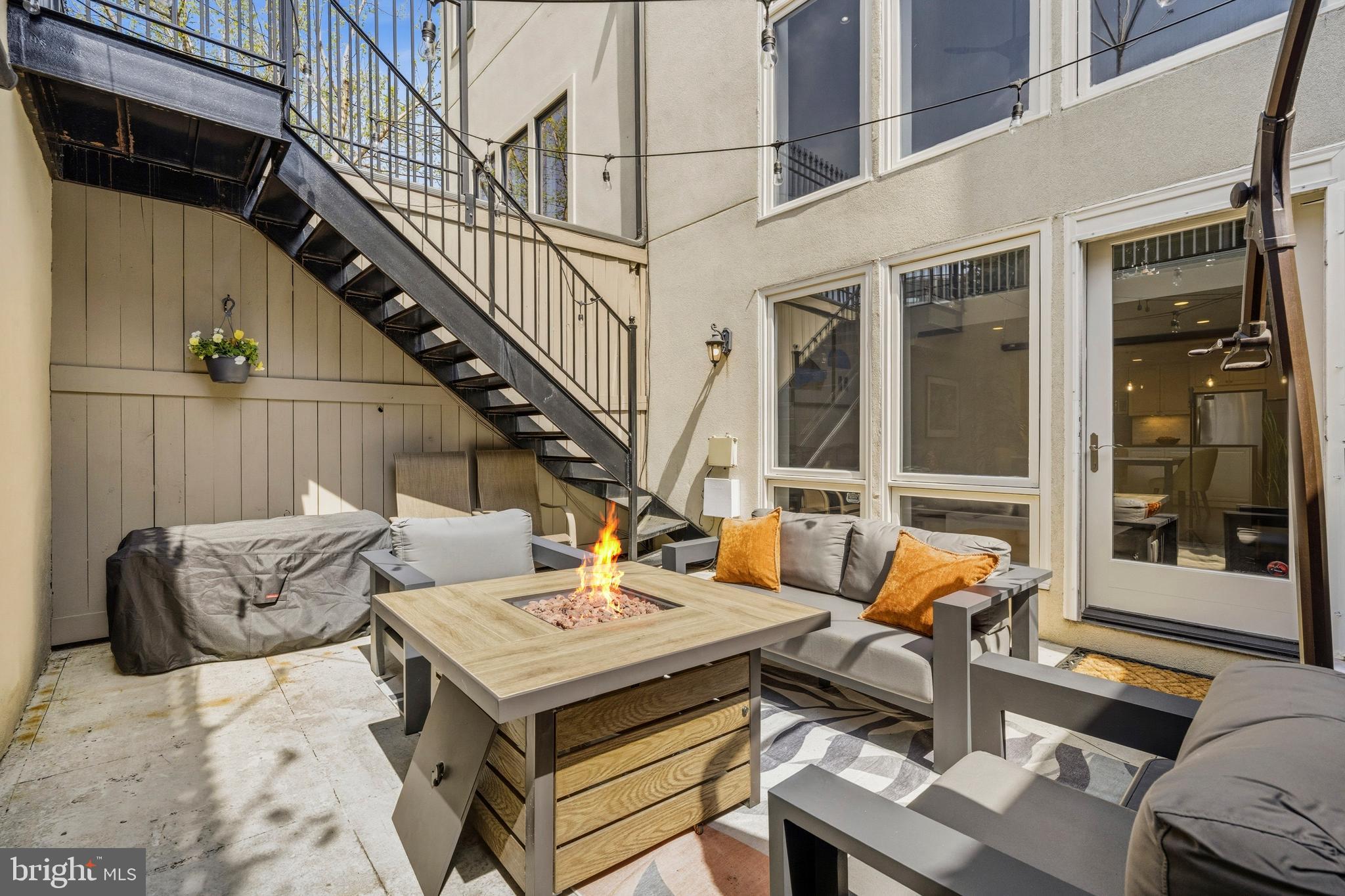 1232 4th Street Northwest, Unit 1 Washington, DC 20001 - Photo 23 of 28 a view of a patio with couches table and chairs