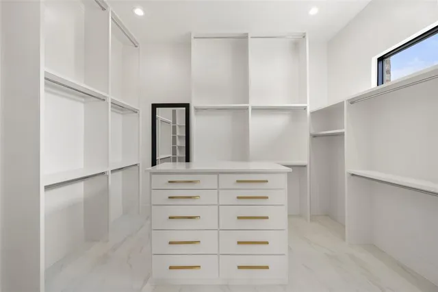 a view of a livingroom with a ceiling fan window and wooden floor