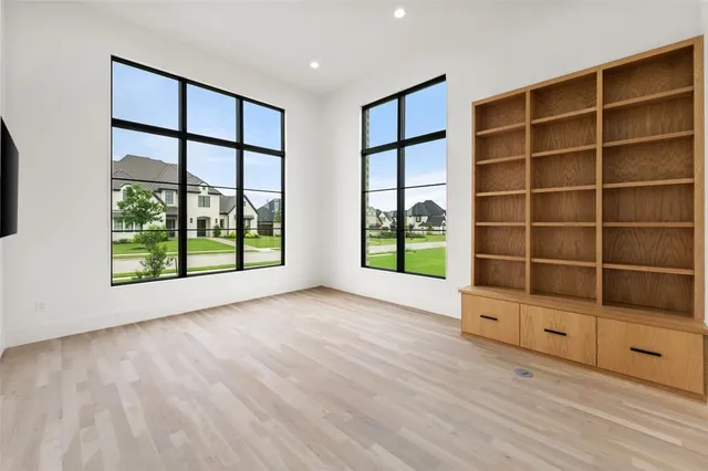 a view of an entryway with wooden floor and windows