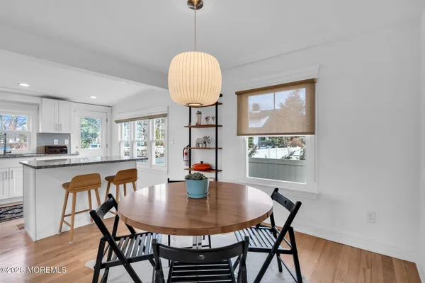 a kitchen with a table and chairs in it