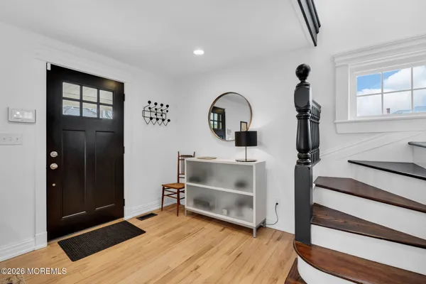 a living room with furniture fireplace and a flat screen tv