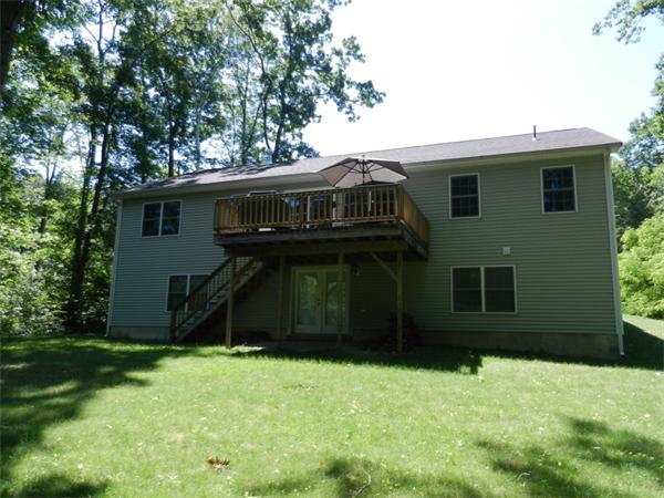 621 Burts Pit Road Northampton, MA 01062 - Photo 3 of 22 a view of a house with a yard and large trees