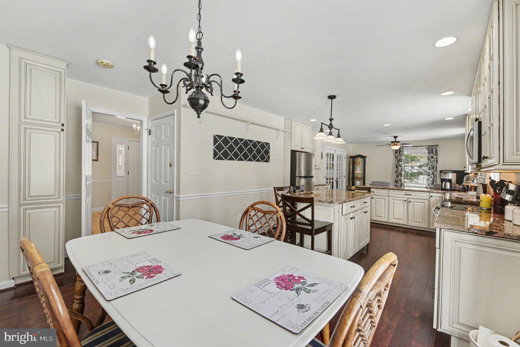 1411 Valley Stream Road Bel Air, MD 21014 - Photo 13 of 49 a bedroom with a bed a chandelier and a dresser