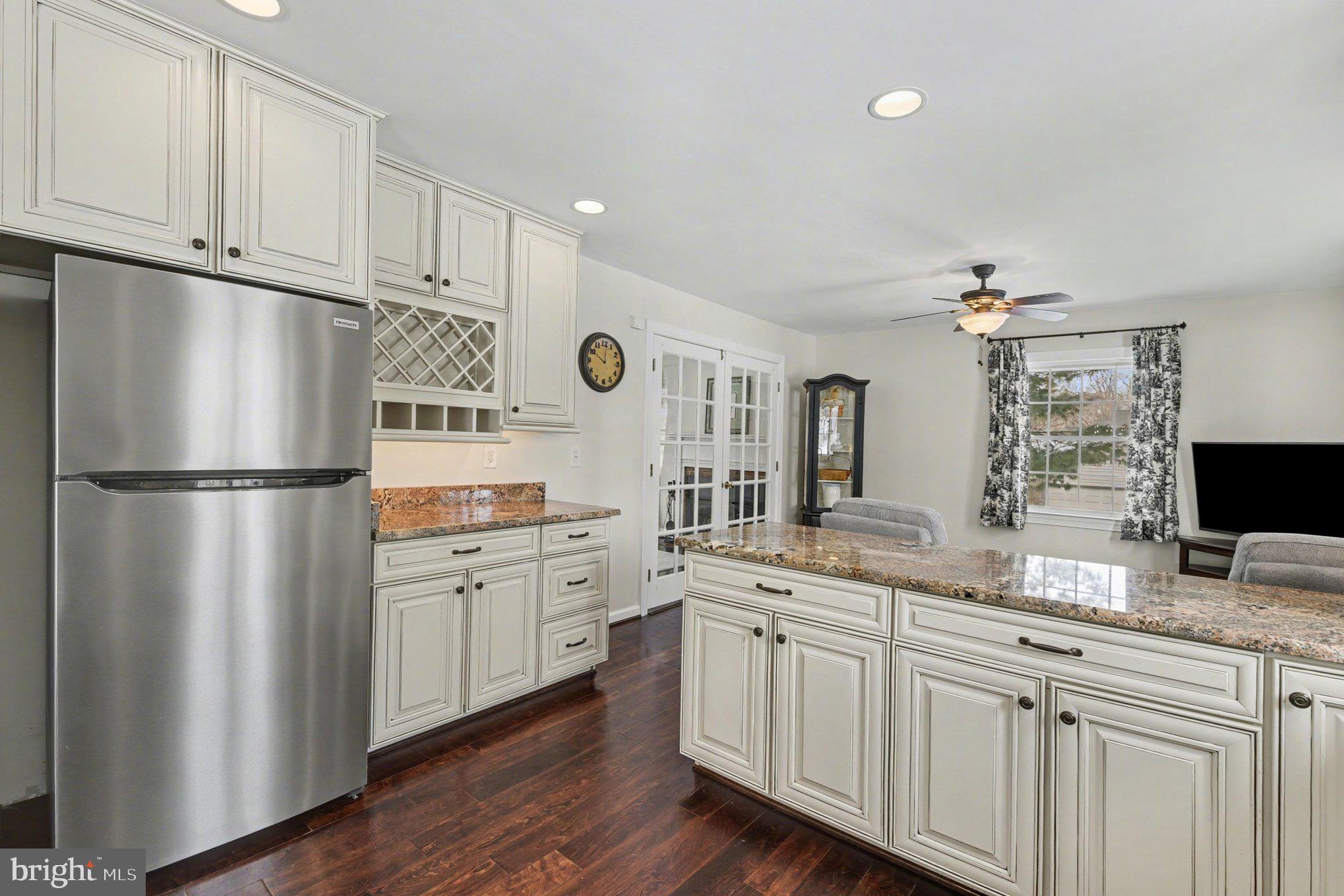 1411 Valley Stream Road Bel Air, MD 21014 - Photo 16 of 49 a kitchen with a refrigerator sink and cabinets
