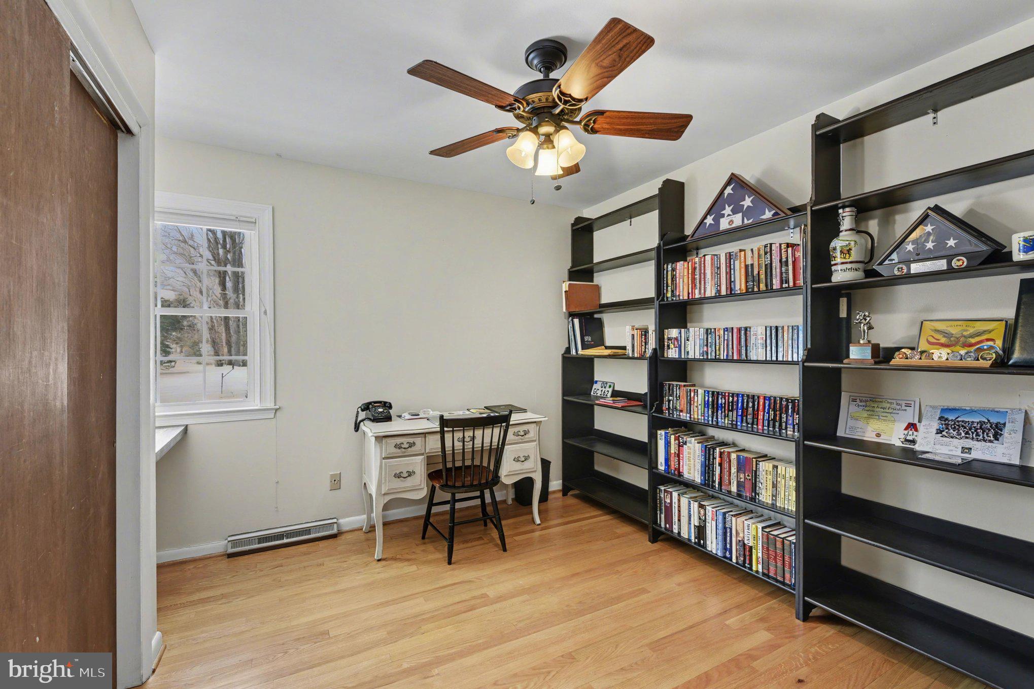 1411 Valley Stream Road Bel Air, MD 21014 - Photo 31 of 49 a view of a workspace with furniture and a bookshelf