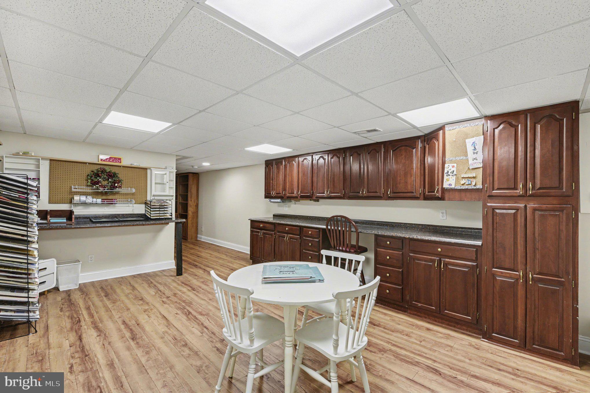 1411 Valley Stream Road Bel Air, MD 21014 - Photo 34 of 49 a kitchen with a table chairs refrigerator and cabinets
