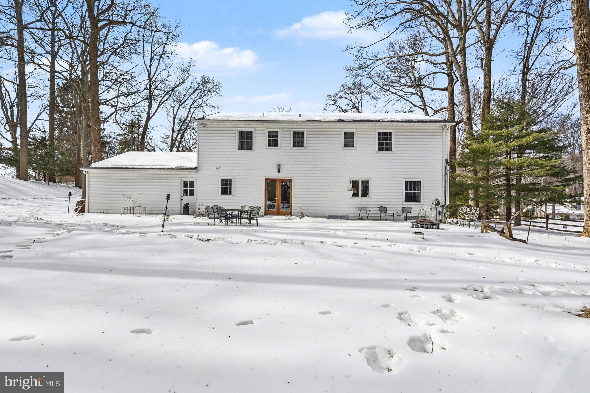1411 Valley Stream Road Bel Air, MD 21014 - Photo 39 of 49 a view of a white house with a snow on the road