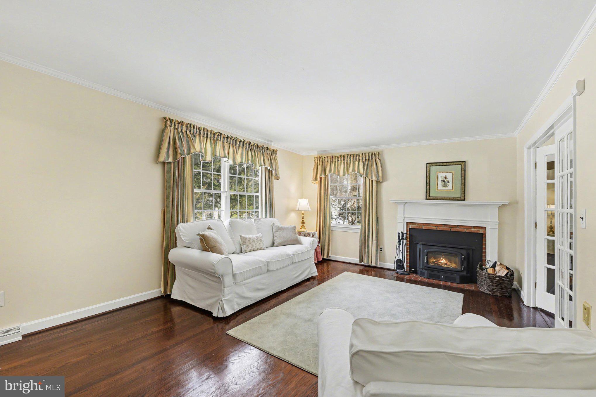 1411 Valley Stream Road Bel Air, MD 21014 - Photo 10 of 49 a living room with furniture and a fireplace